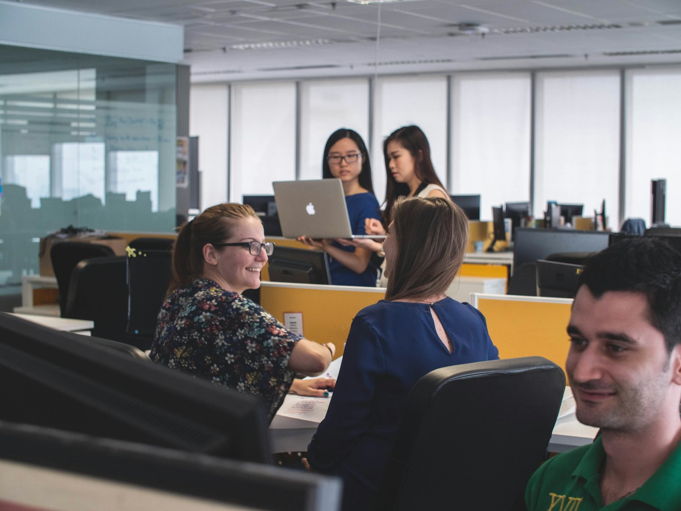 Office team working together in a technology workspace